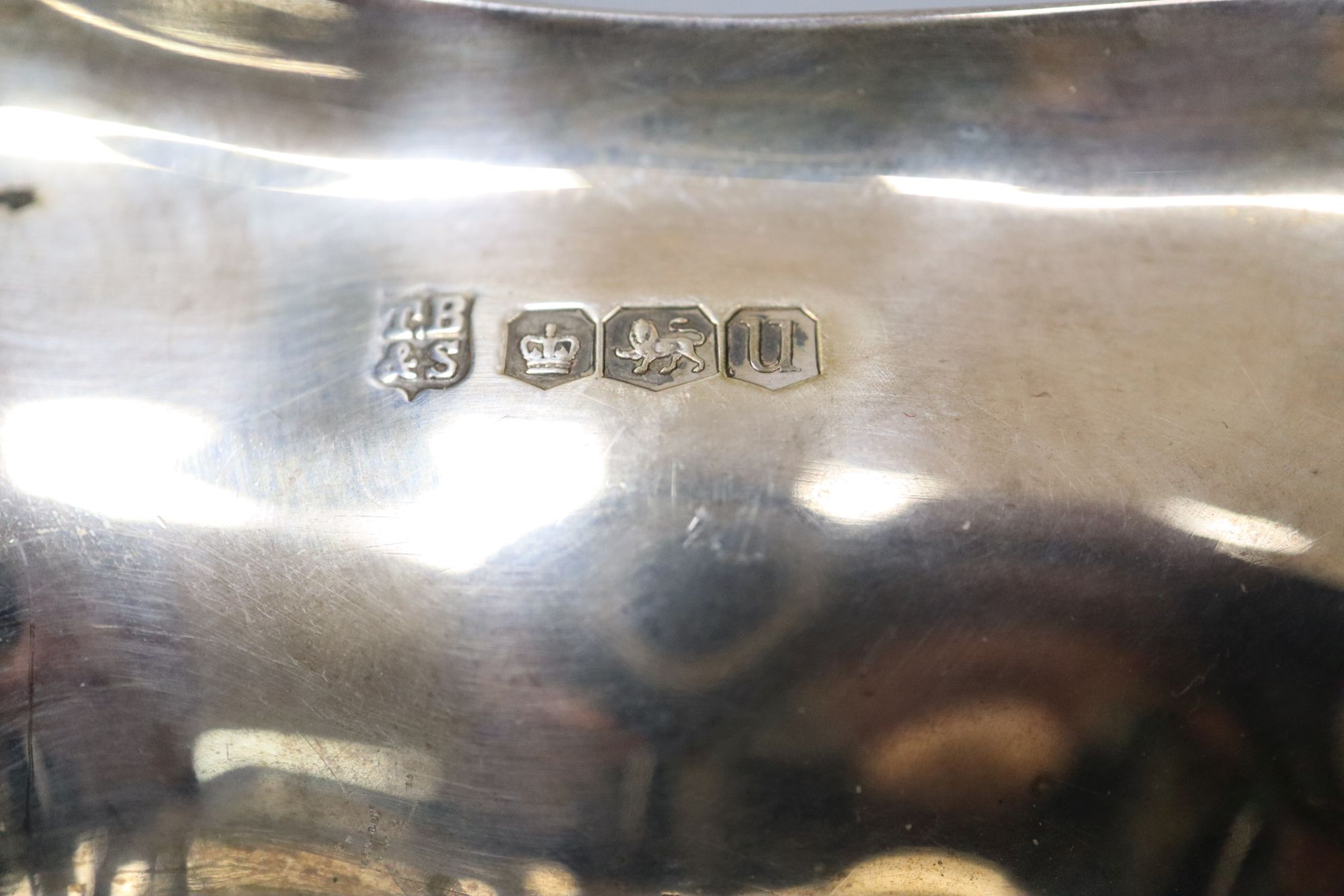 A George VI cusped silver bowl, on four scroll feet, with engraved inscription Thomas Bradbury & Sons, Sheffield, 1937, 15cm, 8.5oz.